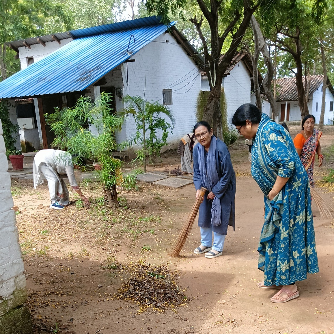 Community members serving and caring for the church grounds together